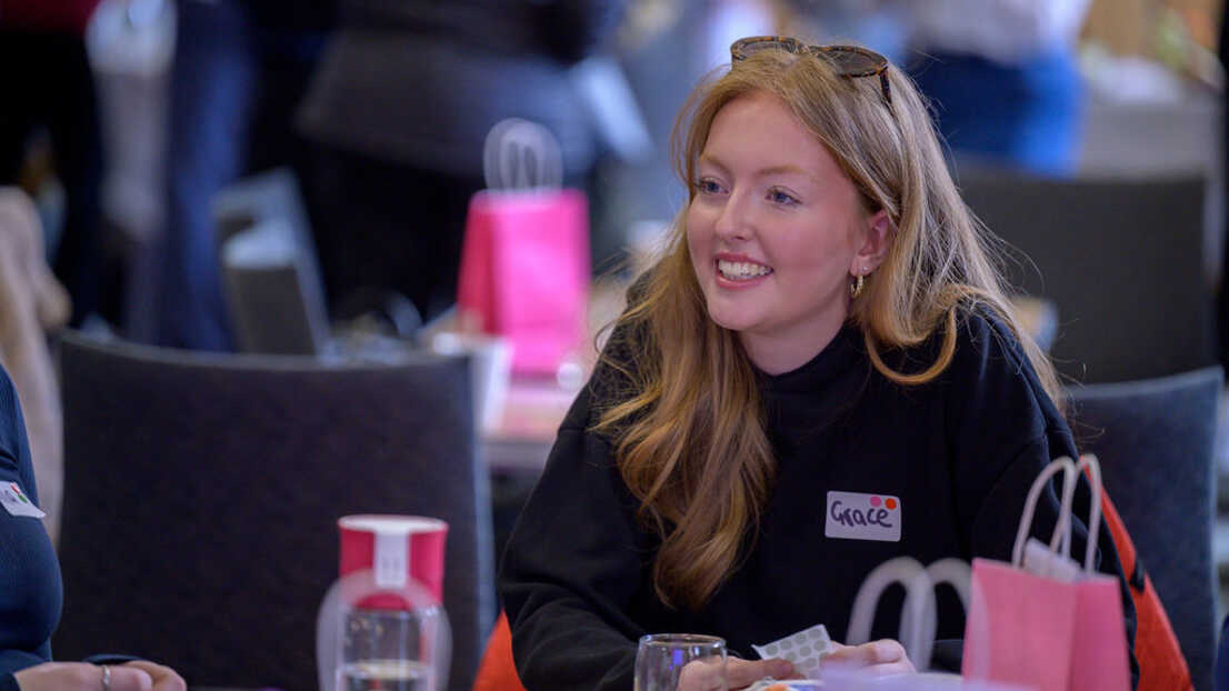 Women smiling on table
