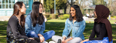 A group of international students sat in Weston Park