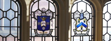 The University crest in stained glass