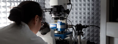 A researcher using an atomic force microscope