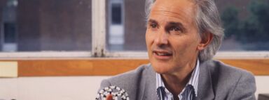 Sir Harry Kroto holding a molecule - image