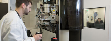 Student taking sample to cryo-electron microscope