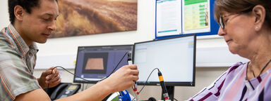 Patient in the Skin Lab being tested with dermatology equipment