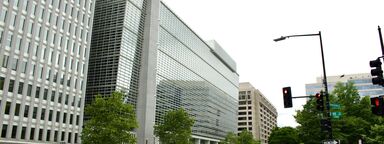 People walking across the street in the financial district