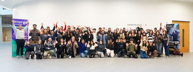 group of students in shot smiling at camera