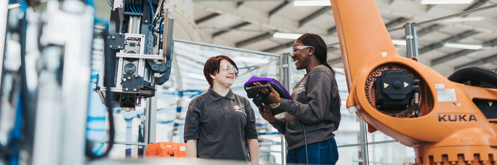 Image shows two University of Sheffield engineers in a manufacturing facility