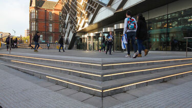 The outside of the Diamond with students walking in front of it