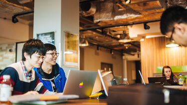 Students drinking coffee with laptops