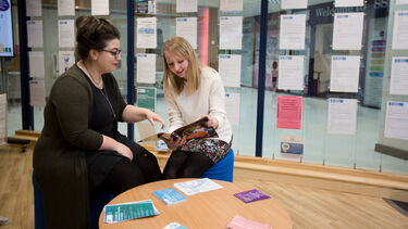 Career advisor in the Student Jobshop speaking to a student