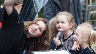 Student volunteering with children