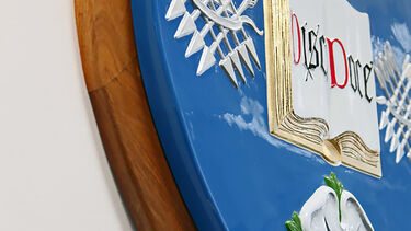 Emblem on the wall in the School of Law.