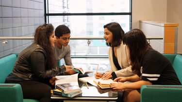Four students having a group discussion