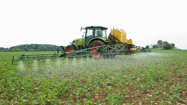 Tractor spraying pesticide