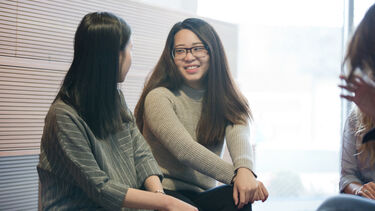 Masters students having conversation