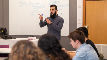 Photo of Dr Burak Tansel giving a seminar
