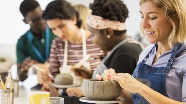 people doing pottery