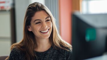 Two postgraduate students doing work. 