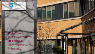 Human Communication Sciences building with welcome sign.