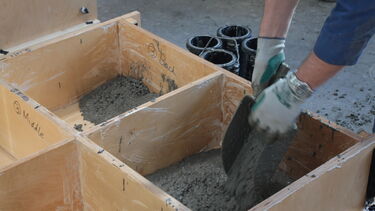 Concrete being poured.