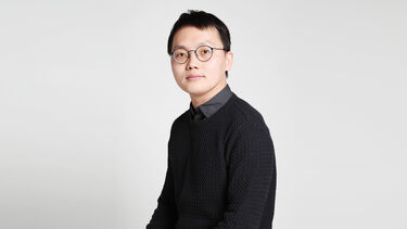 Portrait photograph of Yiye Lin against a plain white background