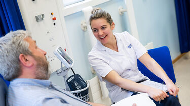 Student nurse with patient