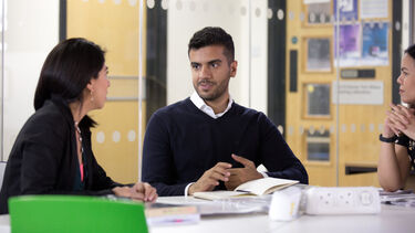 Student discussing work with a fellow student or supervisor