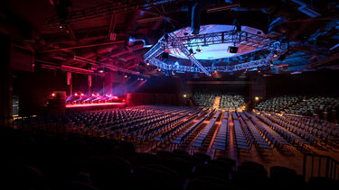 The interior of the Octagon main hall with seating and lights