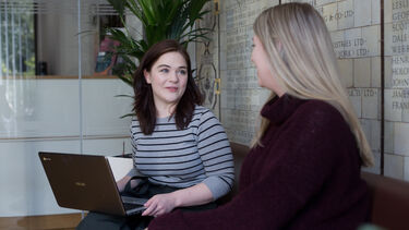 Student experience manager speaking with student