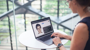 Heidi Christensen working at a computer