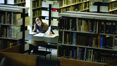 Person in library reading