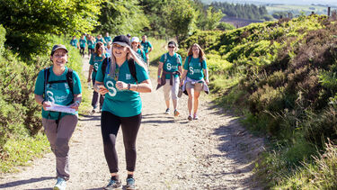 Walkers passing Redmires reservoir