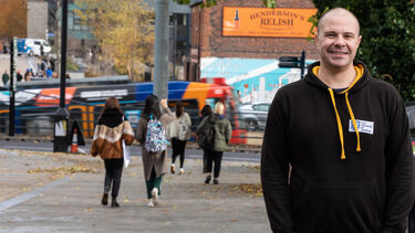 Richard Vyse, Law alumnus, stood outside the Henderson's Relish building in Sheffield