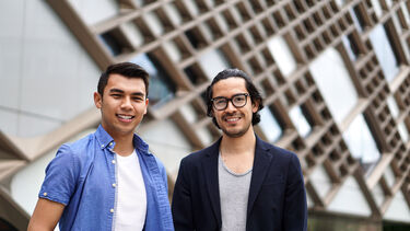 2 students stand outside the diamond