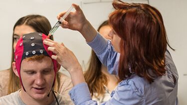 EEG test with cap and syringe