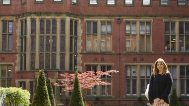 a student is stood in Firth Court