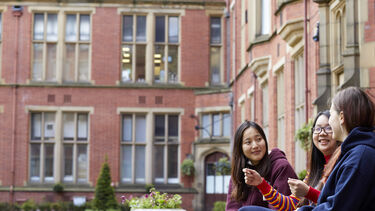 a group of students talking in Firth Court 
