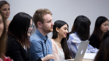 a group of students in a lecture theatre 