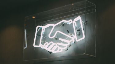 neon light of handshake