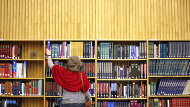 student in library