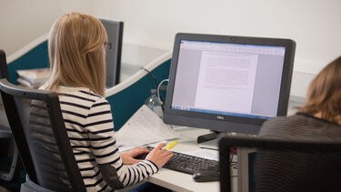 A person typing on a keyboard