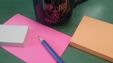 Pen post-its and a mug