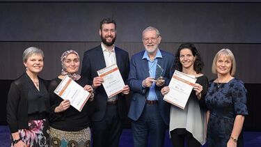 A group photograph of award winners from the Richard Astell award.