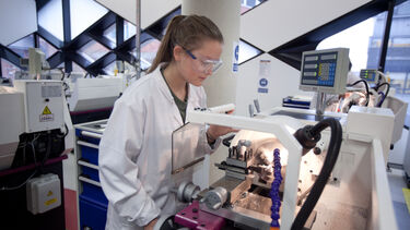 An image of a female student working in a Diamond lab.