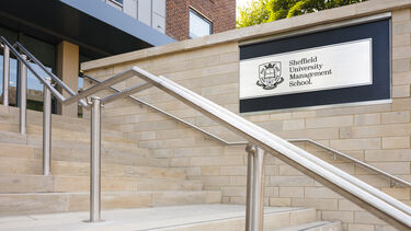 Management School sign outside by steps