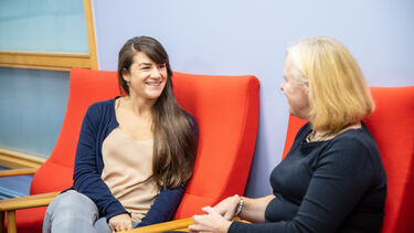 staff talking to student 