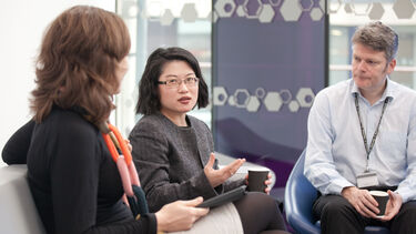 Three academic staff in a meeting
