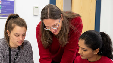 An academic helping students with work. 