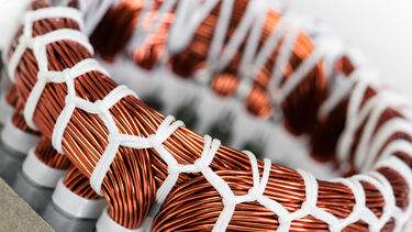 A close up of an electric motor stator and winding stack