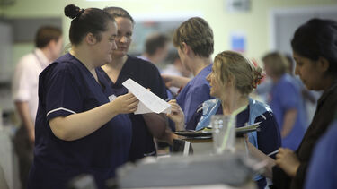 A group of nurses discussing medical information - images 