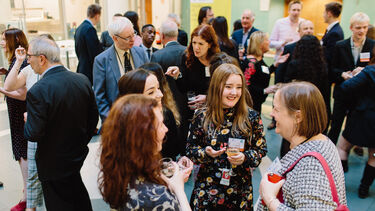 Students and alumni meeting at a networking reception
